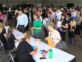 A job fair attended by 11 local companies was held at the St. Clair Centre for the Arts on Sept. 21, 2016 in  Windsor, ON. A full room of applicants wait in line to meet potential employers during the event.