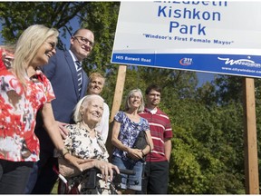 Former Windsor mayor Elizabeth Kishkon, centre, is joined by Mayor Drew Dilkens and her daughters, from left, Kim Fragos, Lisa Kishkon and Jan Kishkon, as well as her only grandson, Kevin Kishkon, at the unveiling of Elizabeth Kishkon Park in East Windsor on Sept. 14, 2017.
