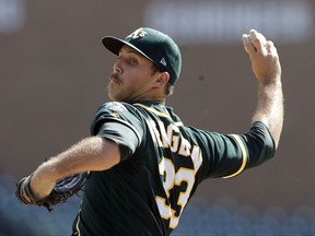 Oakland Athletics starting pitcher Daniel Mengden throws during the first inning of a baseball game against the Detroit Tigers, Wednesday, Sept. 20, 2017, in Detroit. (AP Photo/Carlos Osorio)