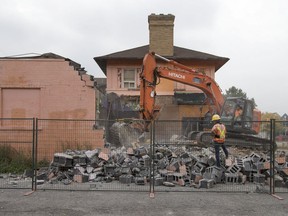 A crew from Rudak Excavating Inc., works on Sept. 18, 2017, to tear down the building at 170 Wyandotte St. W., the former home of the Windsor Music Cafe.
