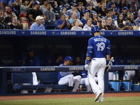 Toronto Blue Jays right fielder Jose Bautista (19) walks back to the dugout after striking out against the Kansas City Royals during sixth inning AL baseball action in Toronto on Thursday, September 21, 2017. Bautista's 160th strike out of the season sets a new franchise single-season record. THE CANADIAN PRESS/Nathan Denette