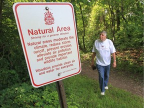 Retired teacher and Windsor environmentalist Tom Henderson, chairman of the public advisory council for the Detroit River group, walks near Ojibway Shores on June 27, 2013.