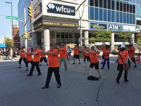 Members of the Taoist Tai Chi Society practice on Ouellette Avenue during Open Streets Windsor on Sept. 17, 2017.