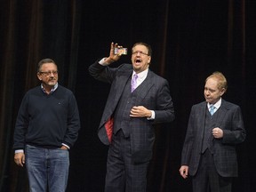 Penn and Teller perform a trick with a participant's mobile phone at Caesars Windsor, Friday, Sept. 8, 2017.