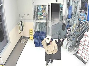 A still image from security camera video showing a masked man and woman who robbed a Rexall drug store at 3840 Howard Ave. on the night of Sept. 14, 2017.
