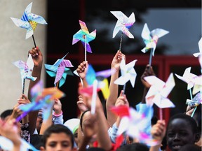 Students from Dougall Public School celebrate with Pinwheels for Peace on Thursday during World Peace Day in Windsor.   The Rotary Club of Windsor 1918 started had a presentation to inspire the students to go out and spread peace in the community. Pinwheels for Peace is an international program that has produced millions of whirling works of art since 2005.