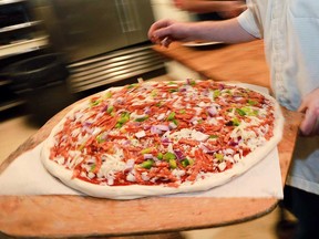 A contest-winning pizza pie about to go in the oven at Sam's Pizzeria and Cantina in December 2016. Sam's won that year's Windsor Pizza Fest contest by Higher Limits. The 2017 edition of the contest begins in October.