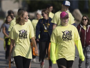 In a file photo from 2017, a five-kilometre walk to kick off Suicide Prevention Awareness Week takes place at St. Clair College in Windsor Sept. 10, 2017.