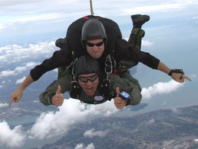 Rick Mercer parachutes over Windsor with Trevor  Lavalee, a member of the Canadian Forces Skyhawks.