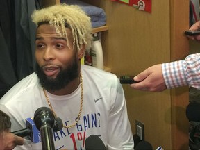 New York Giants wide receiver Odell Beckham Jr. speaks with reporters in the locker room at NFL football team's training facility, Thursday, Sept. 14, 2017, in East Rutherford, N.J. Beckham, who has not practiced since spraining his ankle in a preseason game on Aug. 21, took the next step in his recovery from a sprained left ankle by participating in the individual segment of practice. (AP Photo/Tom Canavan)