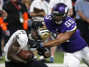 New Orleans Saints running back Alvin Kamara is tackled by Minnesota Vikings outside linebacker Anthony Barr during the second half of an NFL football game, Sept. 11, 2017, in Minneapolis. The Vikings won 29-19.