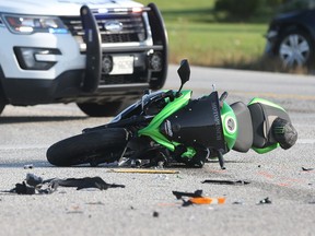 Windsor police investigate a crash betweeen a motorcycle and a car at County Road 42 and Lauzon Parkway in Windsor on Sept. 11, 2017.