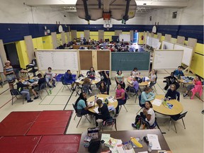 Makeshift classrooms are shown in the St. Bernard Catholic Elementary School gymnasium on Sept. 6, 2017. The school is overcrowded while a new school is nearing the completion of construction.