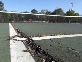 A cracked tennis court surface is seen at Leo Nadalin Tennis Courts at Central Park in Windsor.