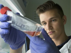 Alex Rodzinka, a third-year biochemistry student at the University of Windsor, handles brain cancer cells during research on September 14, 2017.
