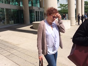 Audrey Annette Bishop leaves Ontario court in Windsor Sept. 14, 2017, after pleading guilty to 31 counts of fraud, theft and forgery.