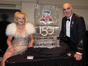 Charity Chix co-ordinator Kim Spirou, left, and Windsor Police Chief Al Frederick pose with ice sculpture at Windsor Police Services 150th anniversary fundraising gala, May 3, 2017.