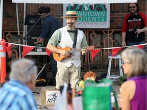 Matt Romain performs for the crowd at the Downtown Farmers' Market on Pelissier Street on Oct. 7, 2017.
