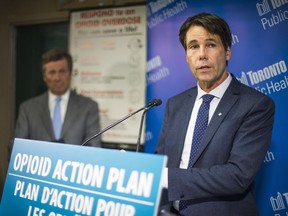 Ontario Health Minister Dr. Eric Hoskins, shown here on June 12, 2017, with Toronto Mayor John Tory at The Works Needle Exchange Program in Toronto, announced Oct. 4 the establishment of an emergency task force to tackle the province's opioid crisis.