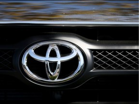 The Toyota logo is displayed on the front of a new Toyota truck at Toyota Marin on October 1, 2013 in San Rafael, California.