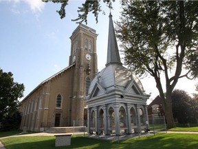 The exterior of St. Anne's Church in Tecumseh, with the steeple on the ground, shown on Aug. 18, 2009.