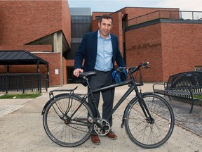 University of Windsor professor Christopher Waters, shows outside the faculty of law on Apirl 25, 2016, routinely takes his bicycle to work and to appointments downtown.