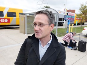 Architect Walter Derhak talks about Ontario's proposed high-speed rail line between Windsor and Toronto on Oct. 25, 2017, after getting off a passenger train at the Via Station in Walkerville.