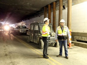 Project director Trevor Pearce, left, and Andrew Elmore of Toebe Construction LLP are shown on Oct. 26, 2017, inside Detroit-Windsor Tunnel where 48,000 square feet of concrete is being removed and replaced.