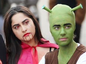 Windsor, Ontario. October 27, 2017.  Ambreen Mubarik, left, and Anna Straszar, both of Riverside Secondary School watch the costume contest during the annual Halloween Fun Run for charity Friday October 27, 2017. The Halloween Fun Run has grown into a school-wide event, with teachers and students participating and most wearing colourful costumes.  $5000 was raised and donated to Kidney Foundation.(NICK BRANCACCIO/Windsor Star)
Nick Brancaccio, NIck Brancaccio