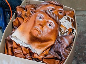 Donald Trump Halloween masks sit in a box in the Shenzhen Lanbingcai Latex Crafts Factory in Shenzhen, China, in this October 2016 photo.