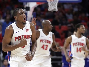 Detroit Pistons guard Langston Galloway, left, and teammates react after a three-point basket by Galloway during the second half of an NBA basketball game against the Philadelphia 76ers on Oct. 23, 2017, in Detroit.