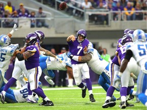 Minnesota quarterback Case Keenum is hit while throwing the ball in the second half of the game against the Detroit Lions on Oct. 1, 2017, at U.S. Bank Stadium in Minneapolis.