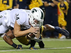 Brian Lewerke of Michigan State dives for a touchdown during the first quarter against Michigan at Michigan Stadium on Oct. 7, 2017 in Ann Arbor, Mich.