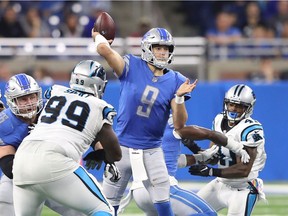 Matthew Stafford #9 of the Detroit Lions drops back to pass during the fourth quarter of the game against the Carolina Panthers at Ford Field on October 8, 2017 in Detroit, Michigan. Carolina defeated Detroit 27-24.