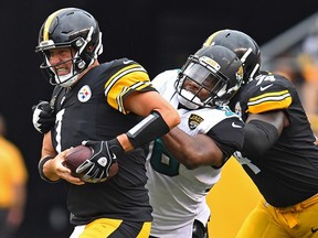 Pittsburgh's Ben Roethlisberger is pressured by Jacksonville's Dante Fowler in the second half of their game at Heinz Field on Oct. 8, 2017 in Pittsburgh.
