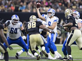 Matthew Stafford of the Detroit Lions throws a pass under pressure during a game against the New Orleans Saints at Mercedes-Benz Superdome on Oct. 15, 2017 in New Orleans.  The Saints defeated the Lions 52-38.