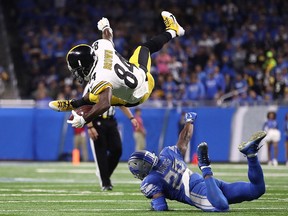 Wide receiver Antonio Brown of the Pittsburgh Steelers is upended by cornerback Quandre Diggs of the Detroit Lions during the third quarter at Ford Field on Oct. 29, 2017 in Detroit.