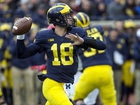 Michigan quarterback Brandon Peters (18) throws a pass in the second quarter of an NCAA college football game in Ann Arbor, Mich., Saturday, Oct. 28, 2017. (AP Photo/Tony Ding)
