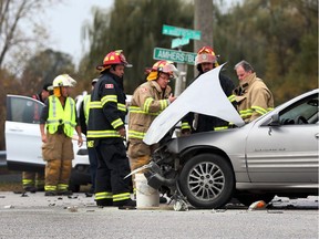 Amherstburg firefighters and police work the scene of a two-vehicle accident at Howard Avenue and County Road 10 on Oct. 27, 2017.  Witnesses said the occupants of one of the vehicles fled the scene in another vehicle. A female patient with unknown injuries was transported to hospital.