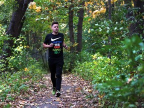 Drew Riach, 35, jogs through the Black Oak Heritage Park near the Ojibway Shores woodlot in Windsor on Oct. 24, 2017.