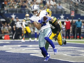 Dallas Cowboys wide receiver Cole Beasley (11) catches a pass for a touchdown in from of Green Bay Packers cornerback Quinten Rollins, rear, in the first half of an NFL football game, Sunday, Oct. 8, 2017, in Arlington, Texas. (AP Photo/Ron Jenkins)