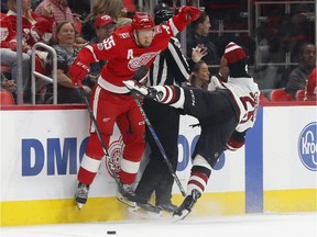 Detroit Red Wings defenceman Niklas Kronwall, of Sweden, checks Arizona Coyotes centre Nick Cousins in the first period of an NHL hockey game on Oct. 31, 2017, in Detroit.