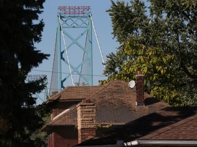 The Ambassador bridge is seen above an area being cleared to to make way for a new span between Windsor and Detroit.