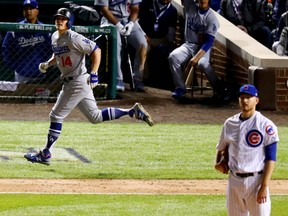 Enrique Hernandez of the Los Angeles Dodgers watches his third homerun of the night leave the ballyard at Wrigley Field in the ninth inning of Thursday's Game 5 of the NLCS against the Chicago Cubs. Hernandez's power display lifted the Dodgers to an 11-1 victory and a 4-1 series win over the Chicago Cubs.