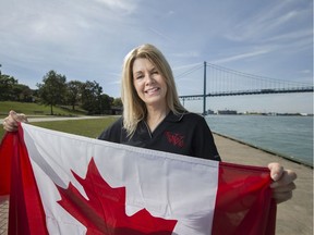 Terri Davis-Fitzpatrick, Flags of Remembrance co-ordinator, is pictured at Assumption Park along Windsor's riverfront on Oct. 2, 2017. Part of a nationwide ceremony, 128 full-sized Maple Leaf flags will be unfurled Saturday.