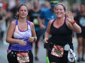 Kelly-Lynn Abraham, left, of Windsor, ON. and Cheryl Barnard of Port Elgin, ON., participate in The Detroit Free Press/Chemical Bank (half) Marathon along Riverside Drive in downtown Windsor, ON. on Sunday, October 15, 2017. (DAN JANISSE/The Windsor Star)