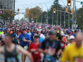 Runners participating in The Detroit Free Press/Chemical Bank Marathon make their way through downtown Windsor, ON. on Sunday, October 15, 2017. The marathon will not be running through Canada this year due to the COVID-19 pandemic.