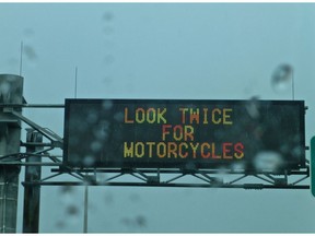 A U.S. sign on I-95 warns drivers to look twice for motorcycles.