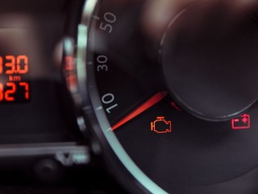 Check engine light. Car dashboard in close-up. Car malfunction. Photo by Getty Images.