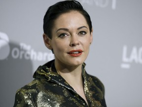 FILE - In this April 15, 2015 file photo, Rose McGowan arrives at the LA Premiere Of "DIOR & I" held at the Leo S. Bing Theatre in Los Angeles. McGowan emerged from a brief suspension on Twitter on Thursday, Oct. 12, 2017, to offer her most pointed accusation that she was sexually abused by film mogul Harvey Weinstein. Weinstein's representative says the producer denies he engaged in "any non-consensual contact."
